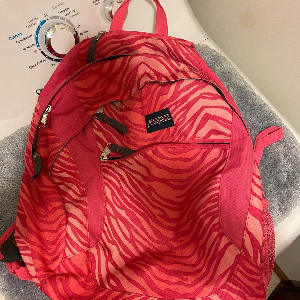 Jansport coral colored backpack.